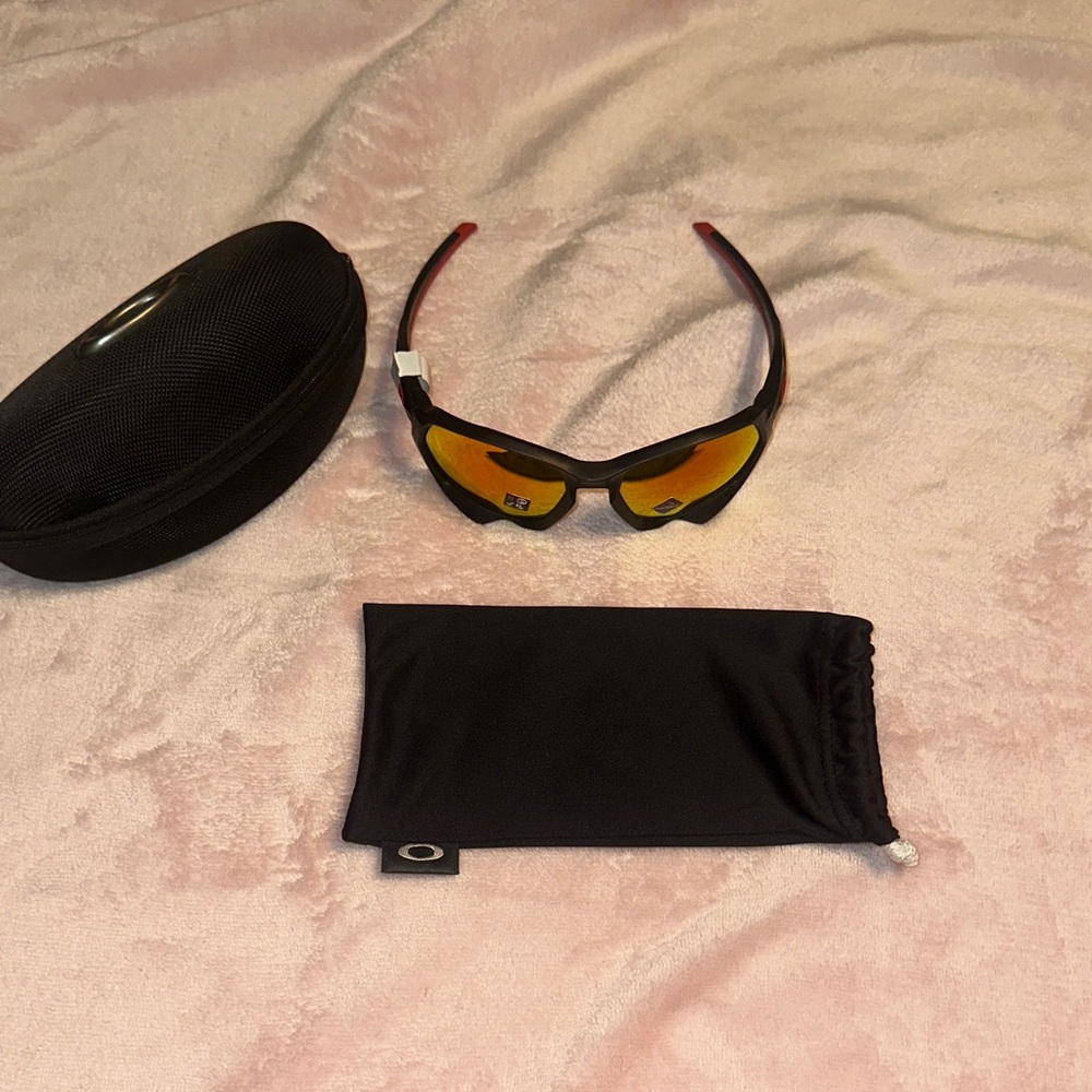 Oakley Black and Red Sunglasses with Yellow Lenses